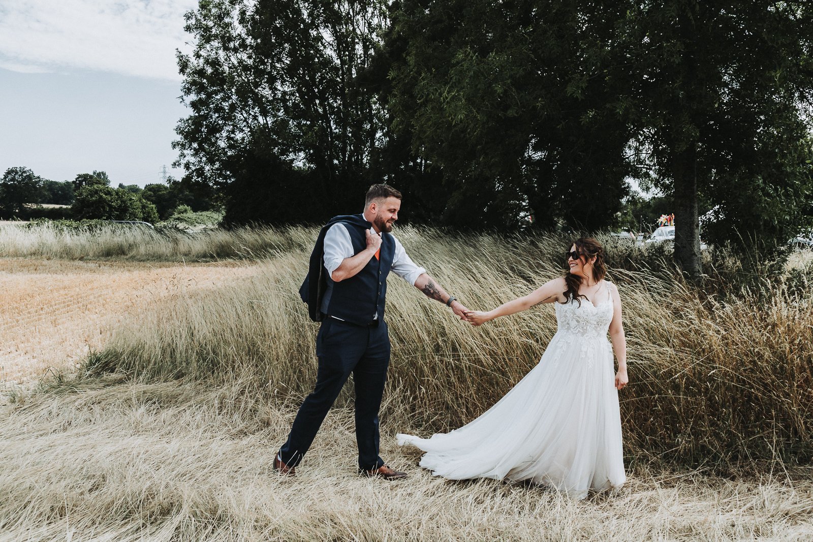 Bride and groom are holding hands.