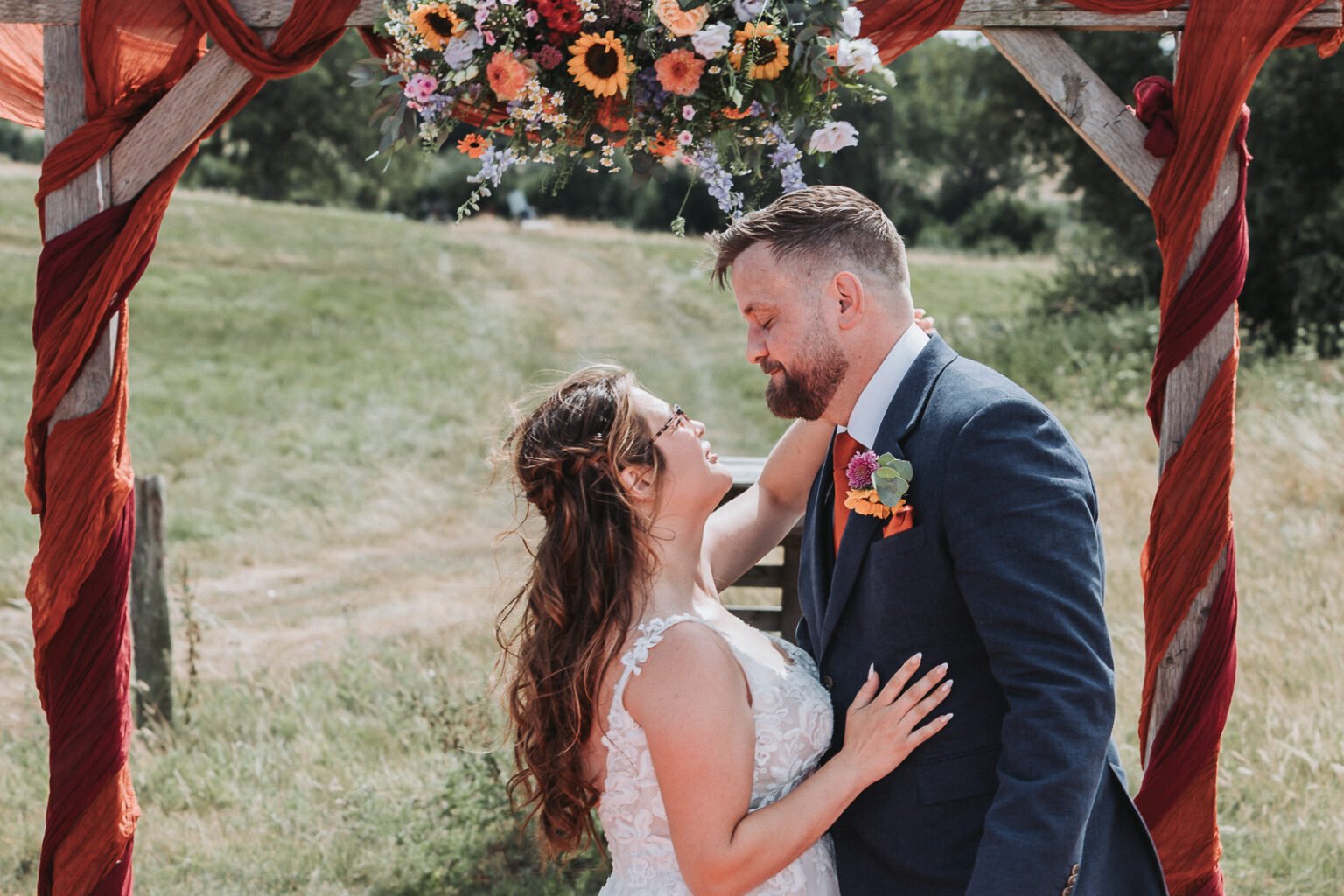 Bride and groom are looking at each other in Sole Events in Hampshire during wedding photography.