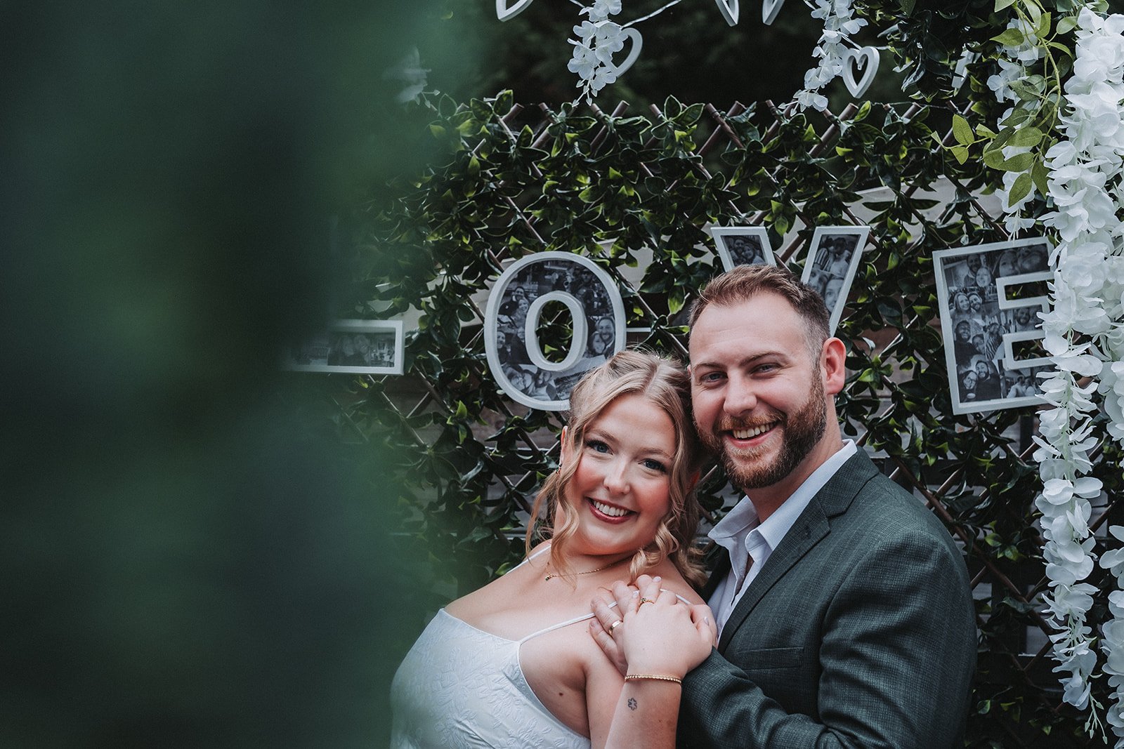 Bride and groom pose during wedding photography.
